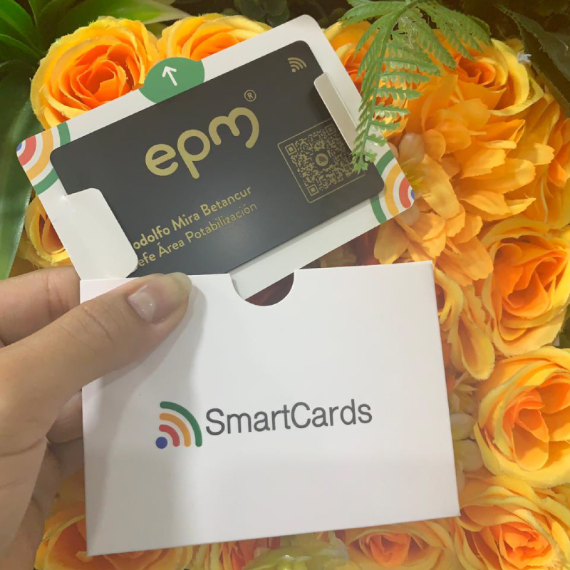 Hand holding a SmartCards cardholder with an ePay card inside, orange roses forming a bright background